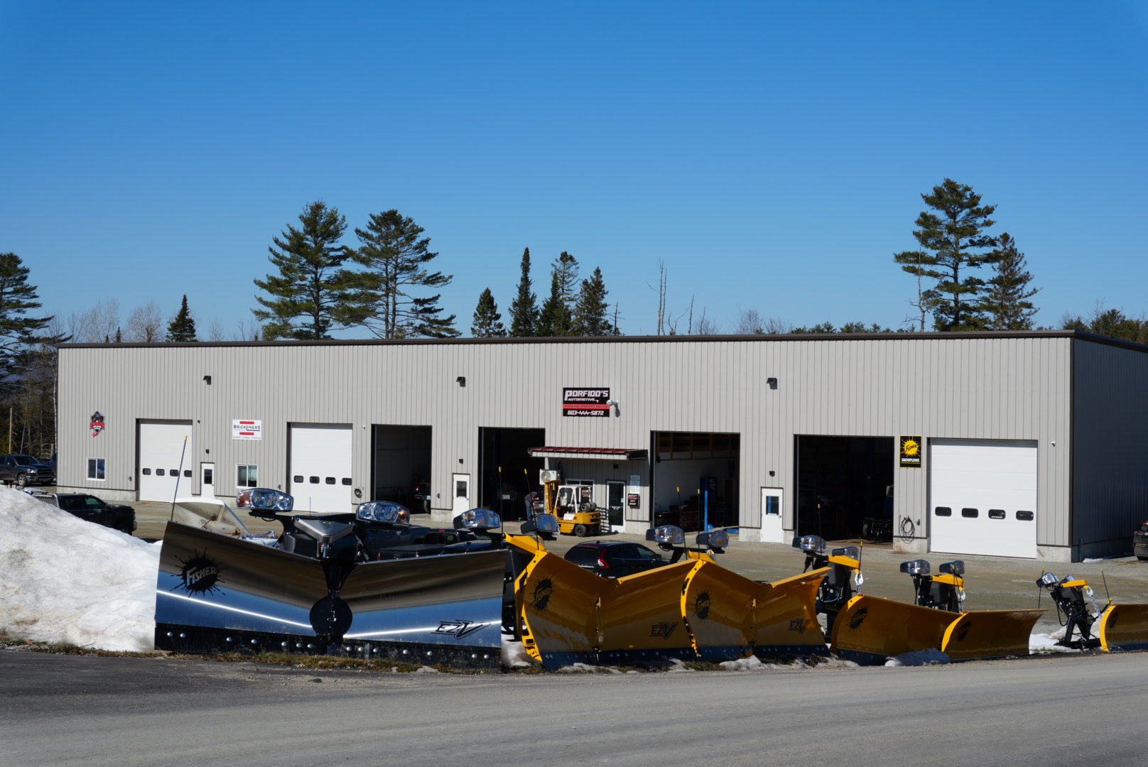 Porfido's Automotive shop with Fisher plows